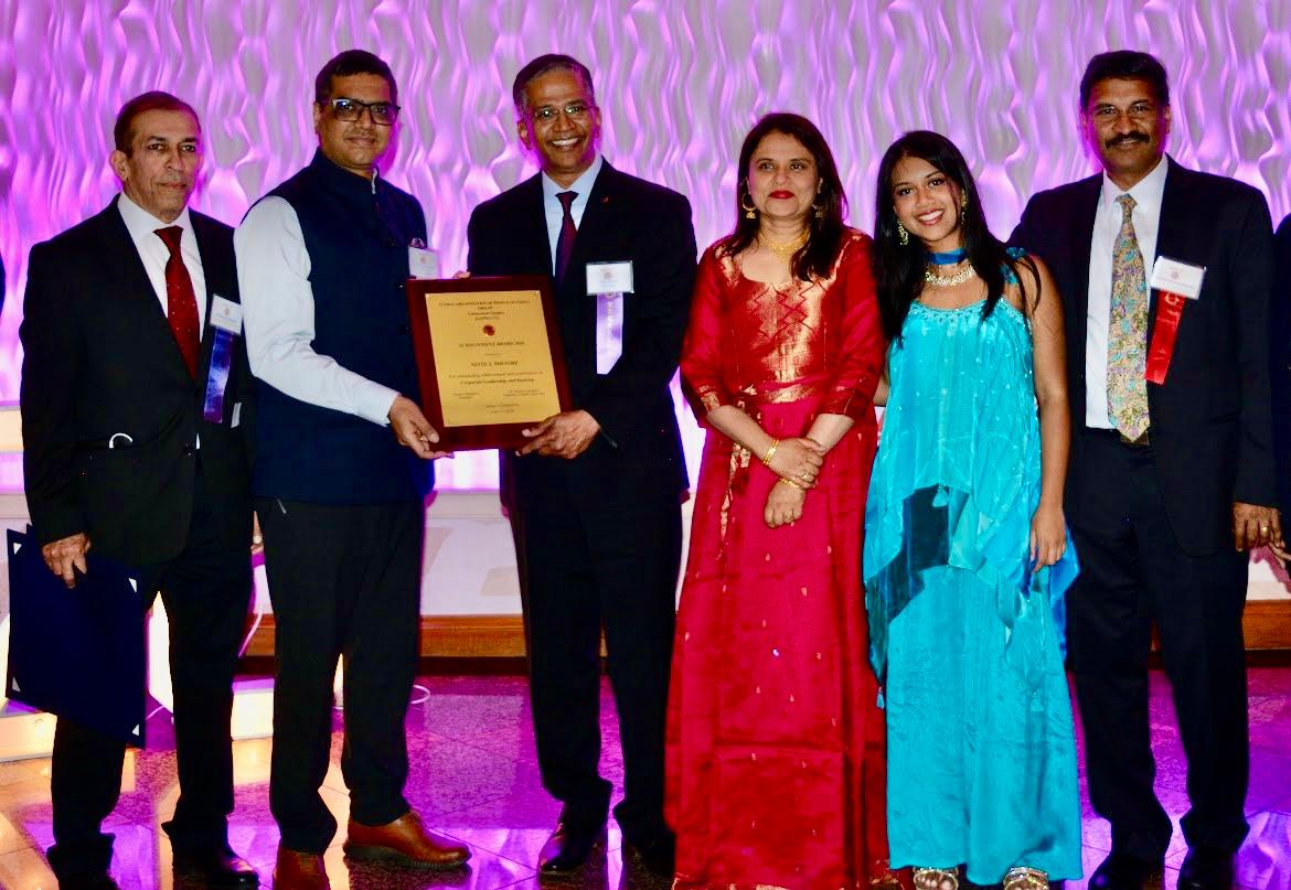 DCG Vishal Harsh presenting the award to Nitin Mhatre Chief Executive Officer at First County Bank